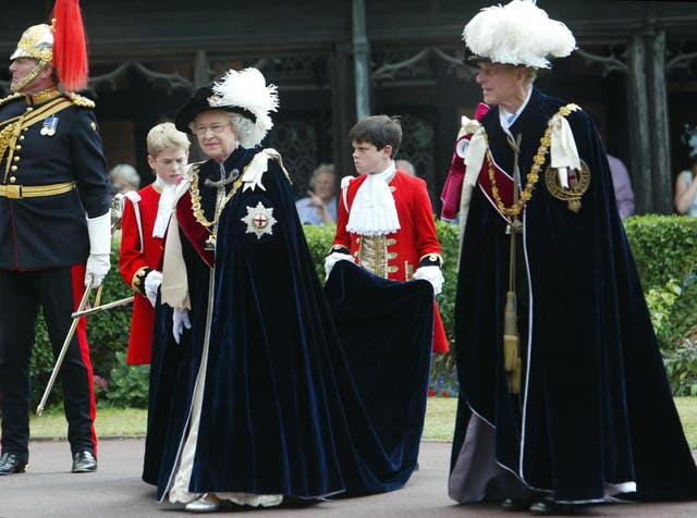 The Queen and the Duke of Edinburgh in their Order of the Garter robes. The Order was founded by Edward III (PA)