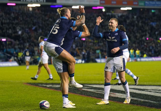 Cam Redpath, centre, celebrates