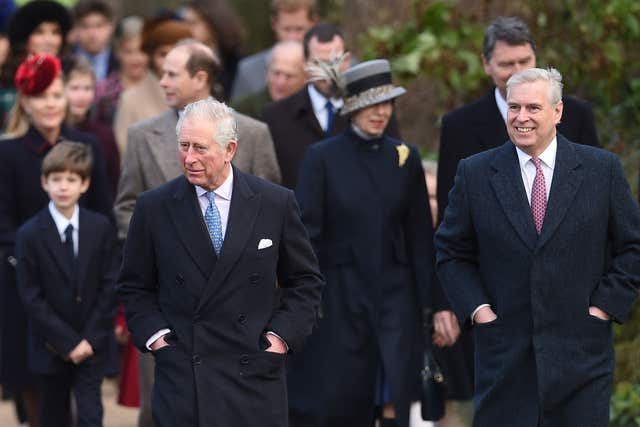 The then-Prince of Wales and the Duke of York walking to church in winter overcoats on the Christmas Day morning church service at St Mary Magdalene Church in 2017