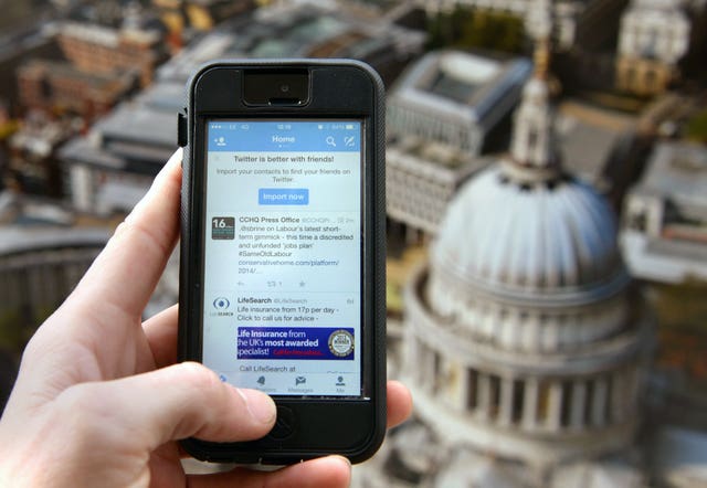 An iPhone 5 is used to view Twitter in London (Anthony Devlin/PA)