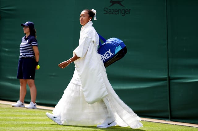 Naomi Osaka walks out for her match