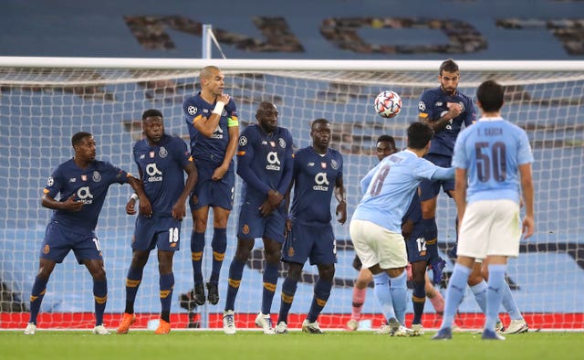 Manchester City’s Ilkay Gundogan scored a fine free-kick in a 3-1 win over Porto