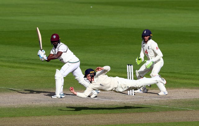 England's Ollie Pope takes the winning catch to dismiss West Indies batsman Kemar Roach during day five of the Second Test at Old Trafford. Pope's outstanding short-leg grab off the bowling of Dom Bess came after Ben Stokes' brilliance - a first-innings knock of 176 followed by 78 not out - put the hosts on course for victory. England went on to win the series 2-1