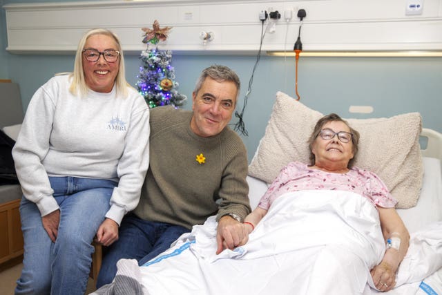 Actor James Nesbitt poses with in-patient Rosemary Allan and her daughter Joanne Allan (left) at the Marie Curie Hospice in Belfast