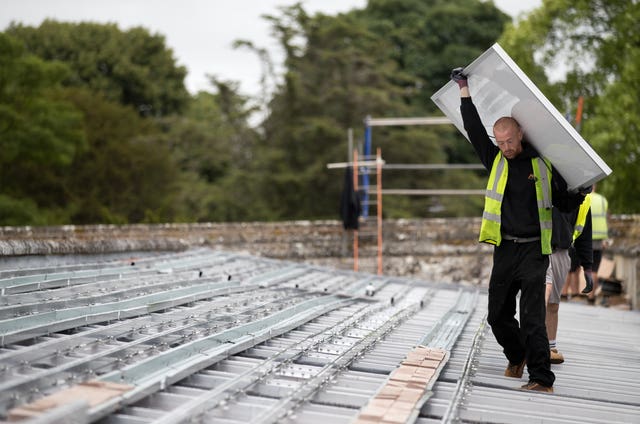 Solar panels are installed on the roof of Salisbury Cathedral’s south cloister 