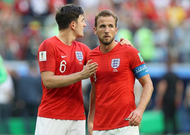 Harry Maguire and Harry Kane embrace