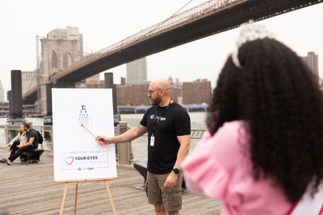 A woman has her eyes tested at Brooklyn Bridge to mark World Sight Test as concerns are raised about the coronavirus pandemic causing a delay in treating sight problems