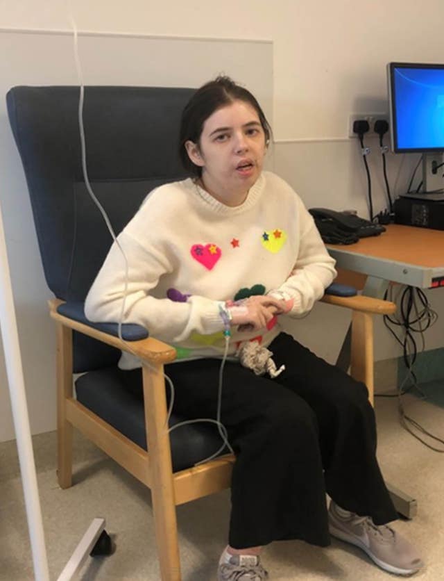 Chloe Every sitting in a chair in a hospital