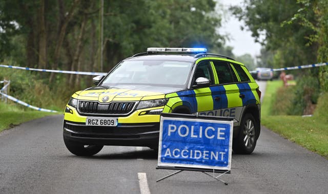Police car and tape at the scene of the shooting