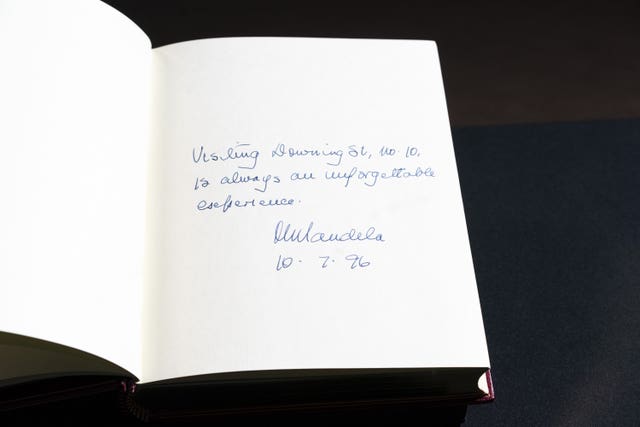 The signature of Nelson Mandela is seen in one of three Downing Street Visitors Books at the National Archives 