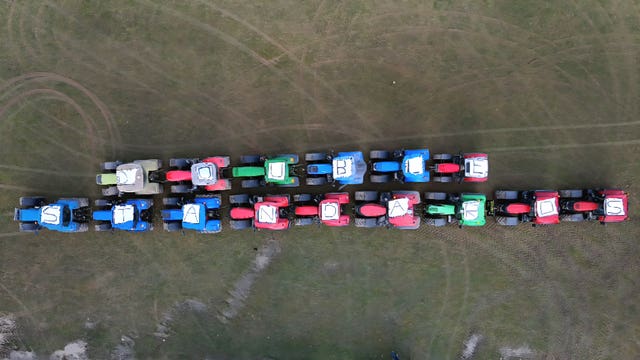 Tractors spell out the words Double Standards during a protest outside minister Martin Heydon’s constituency office