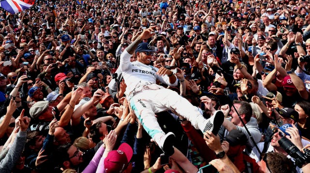 Lewis Hamilton enjoys a celebratory crowd surf following his victory at the 2016 British Grand Prix. By the end of the decade, Hamilton had put his name alongside Formula One’s immortals after driving to a record sixth Silverstone win, surpassing Jim Clark and Alain Prost as the king of the British race