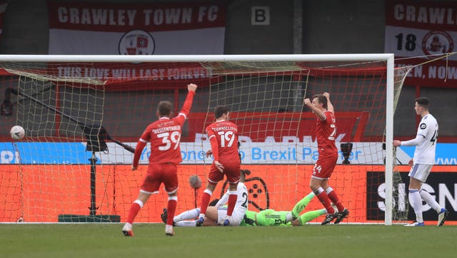 Crawley Town’s Jordan Tunnicliffe (centre) scores his side’s third goal of the game during the Emirates FA Cup third round match at the People’s Pension Stadium, Crawley.