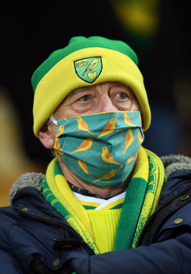 Fans must wear face coverings in indoor areas at stadiums and on public transport on their way to a match