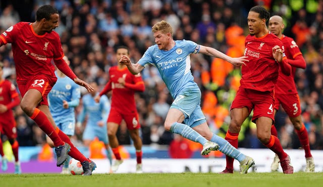 Kevin De Bruyne is brought down by Virgil van Dijk