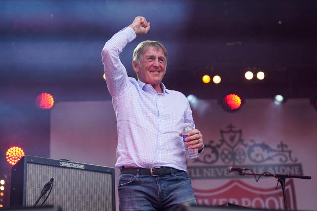 Sir Kenny Dalglish greets supporters in the fan zone 