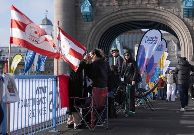 Spectators on Tower Bridge ahead of the London Marathaon