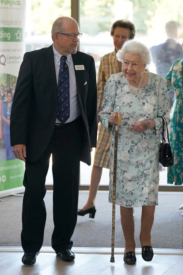 Queen Elizabeth II with Jonathan Jones, chairman of the trustees, during a visit to officially open the new building at Thames Hospice, Maidenhead, Berkshire