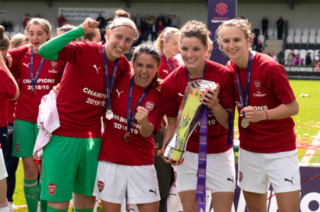 Midema and her Arsenal team-mates celebrate winning the Women's Super League in 2019 (John Walton/PA)