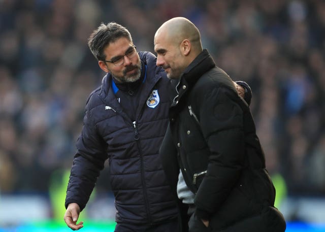 David Wagner, left, and Manchester City manager Pep Guardiola