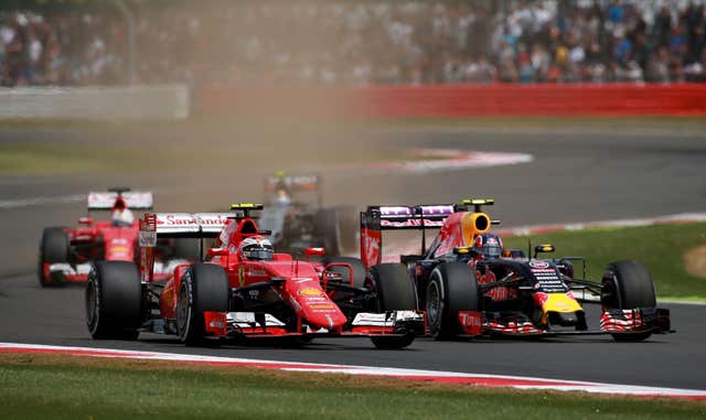Ferrari’s Kimi Raikkonen races Red Bull’s Daniil Kvyat at Silverstone 