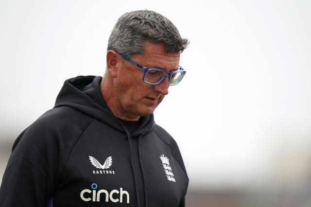 England Women's coach Jon Lewis stares at the floor during a net session.