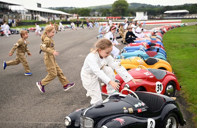 Young racers run to their vehicles as they prepare to compete in the Settrington Cup