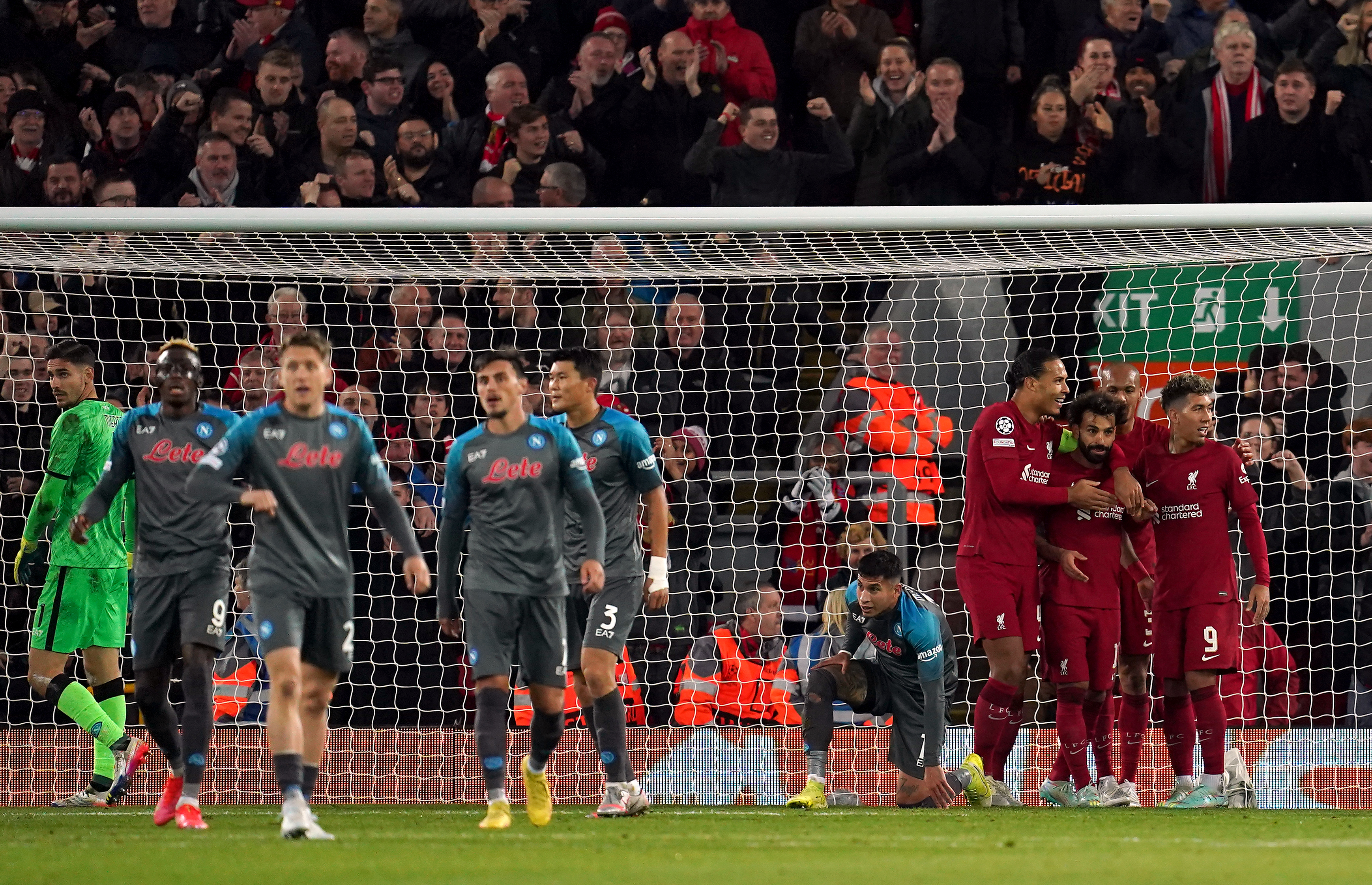 Mohamed Salah, third right, takes the plaudits after his landmark goal (Nick Potts/PA)