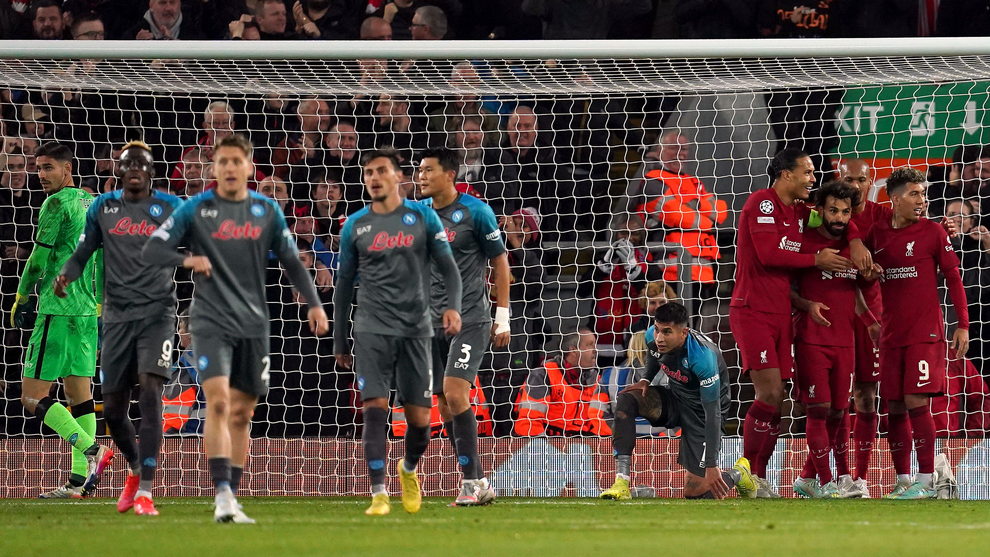 Mohamed Salah, third right, takes the plaudits after his landmark goal (Nick Potts/PA)