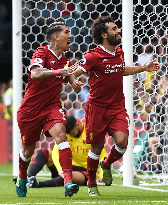 Liverpool’s Mohamed Salah (right) and Roberto Firmino have been outstanding this season