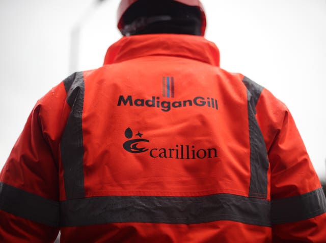 A worker wearing a hi-vis jacket at a Carillion construction site in central London