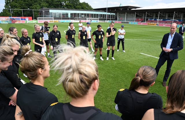 Prince William speaks to the squad after their training session (Paul Ellis/PA).