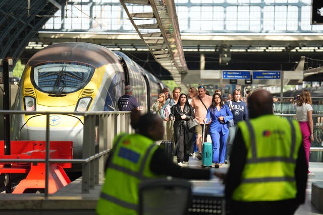 Passengers arrive by train at the Eurostar terminal at St Pancras station