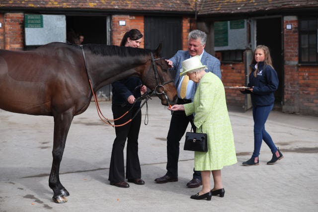 The Queen with trainer Paul Nicholls at the Manor Farm Stables in Ditcheat