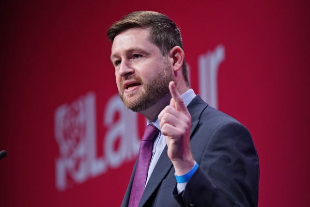 Jim McMahon with Labour backdrop