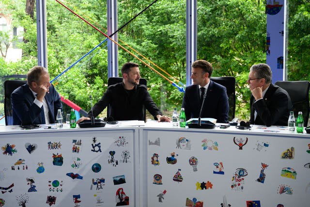 Donald Tusk, Volodymyr Zelensky, Emmanuel Macron and Keir Starmer talk during the European Political Community summit in Tirana