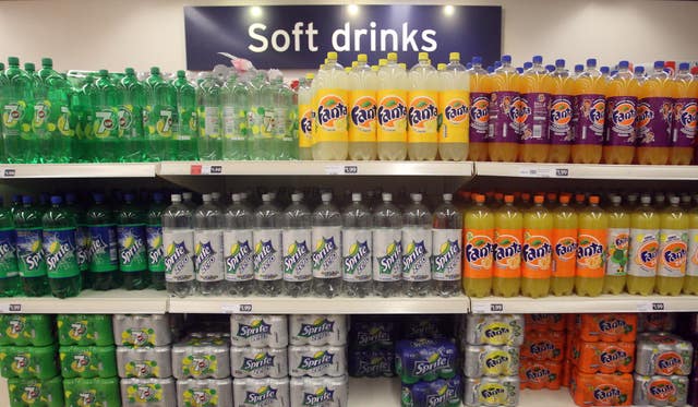 Soft drinks on the shelves of a supermarket