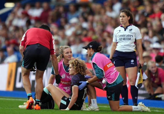 Ellie Kildunne (centre) receives treatment after suffering a head injury 