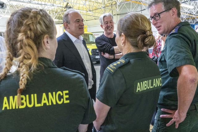  Sir Ed Davey talks to staff during a visit to Wimbledon Ambulance Station