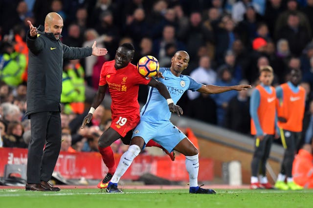 Sadio Mane, centre, is watched by Pep Guardiola 