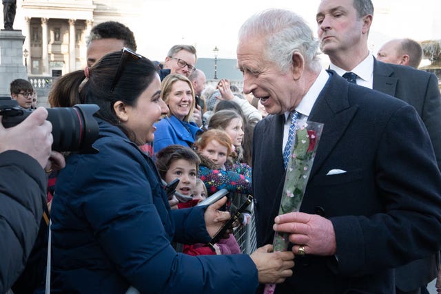 Charles is given a rose for St Valentine’s Day by a well-wisher