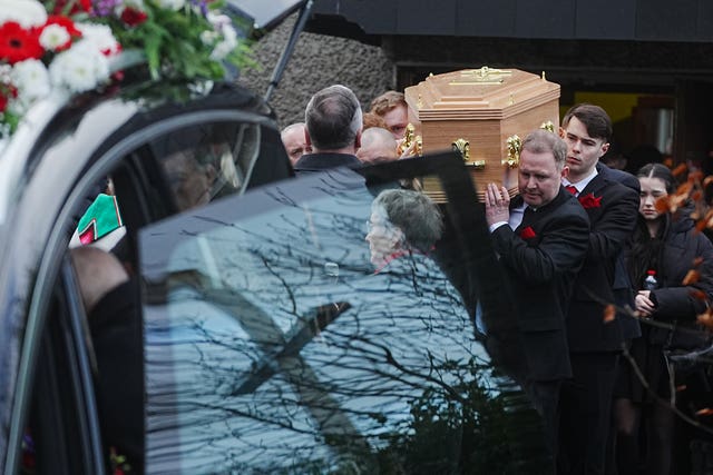 The coffin is carried to the hearse following the funeral mass of 16-year-old Grace Lynch
