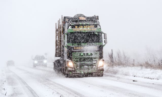 A lorry driving through snow