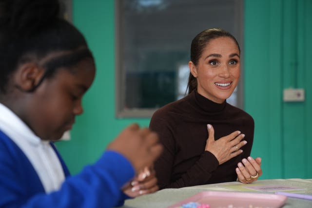 Meghan joins a jewellery making session during the visit