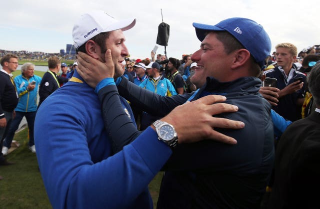 Jon Rahm (left) was emotional after beating Tiger Woods