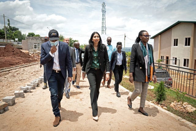 Suella Braverman among a group of people during a visit to Rwanda