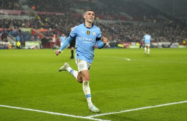 Manchester City’s Phil Foden celebrates scoring a goal by running towards the corner