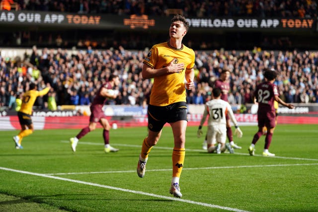 Jorgen Strand Larsen runs off to celebrate netting Wolves'' opener against Manchester City