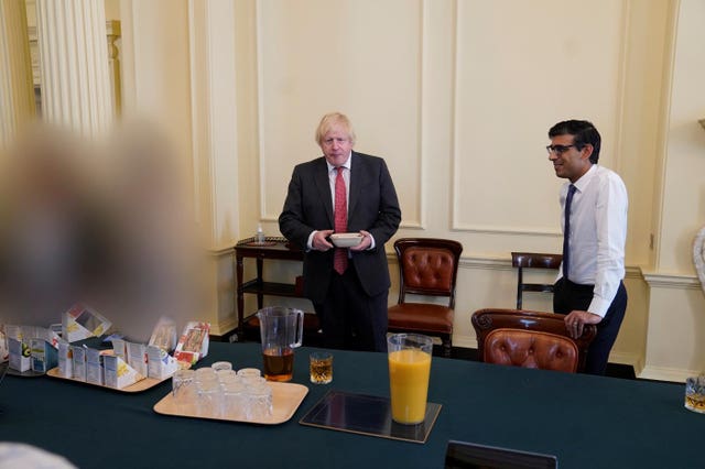 Boris Johnson and Chancellor Rishi Sunak pictured at the surprise birthday bash for the Prime Minister