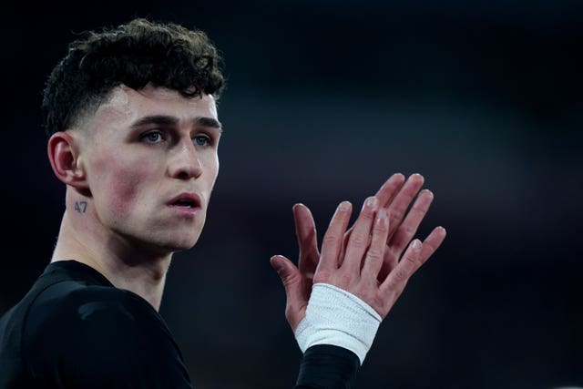 Phil Foden applauds the crowd